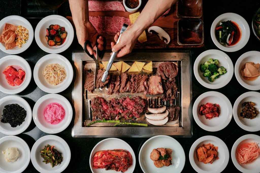 Grill with meats being cut at the table